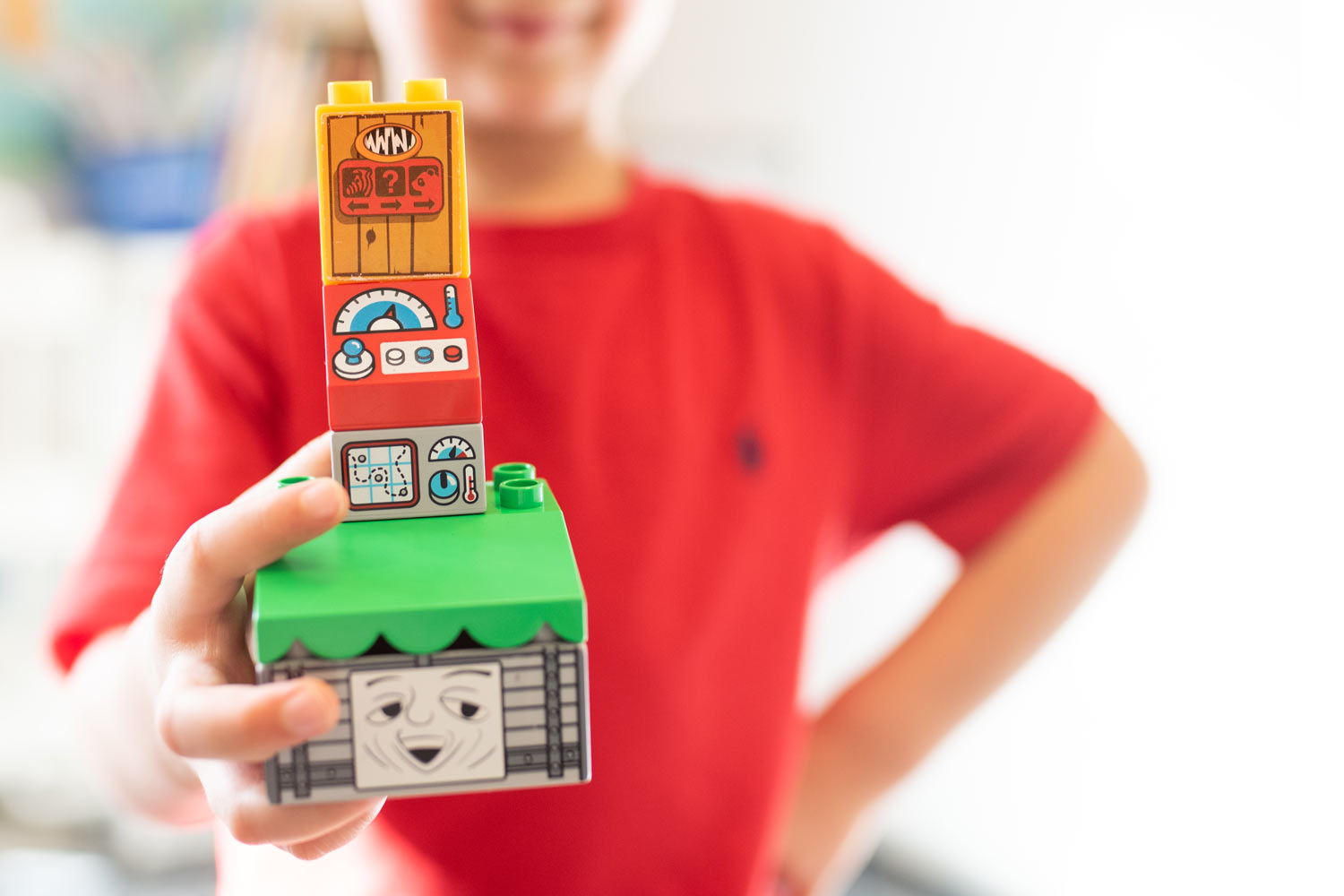 up early intervention clinic child holding built lego